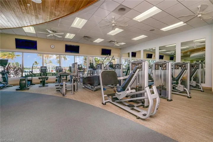 Gym featuring light carpet and ceiling fan