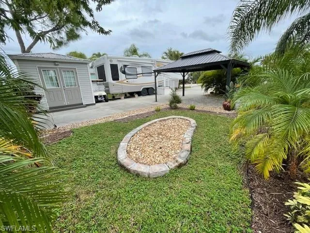 View of yard featuring a patio, a gazebo, and french doors