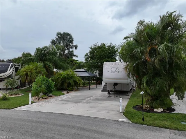 View of community featuring a yard