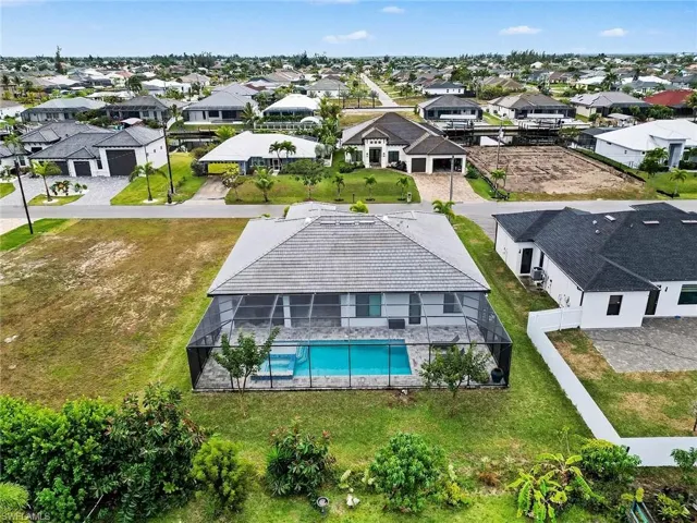 Aerial view of residential area featuring a pool
