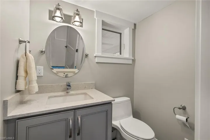 Half bath with toilet and vanity