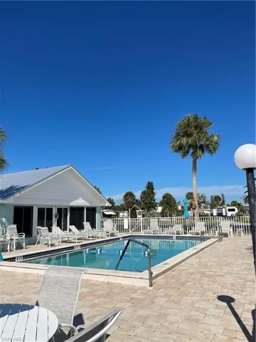 Community pool featuring a patio