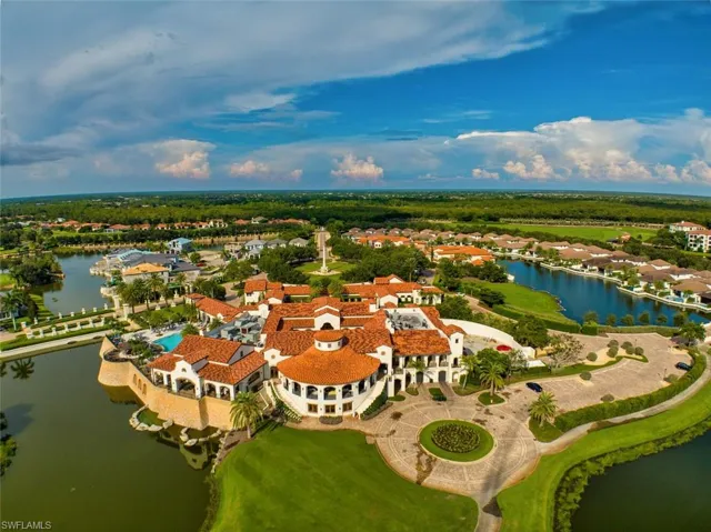 Aerial perspective of suburban area with a nearby body of water