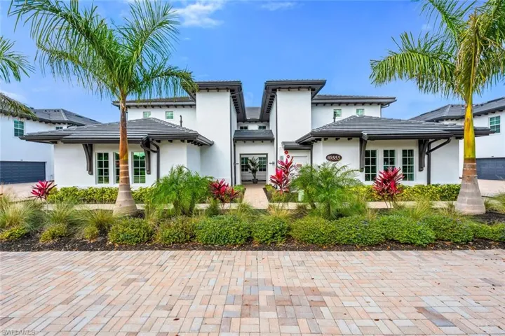 Rear view of house with stucco siding