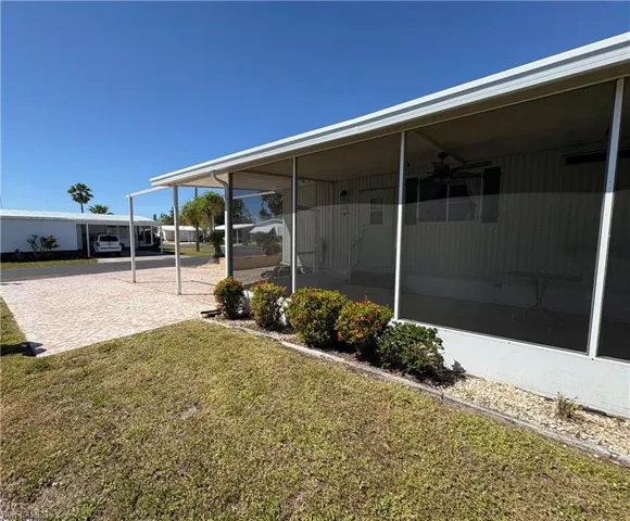 View of yard featuring a sunroom