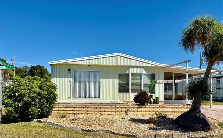 Rear view of property featuring a carport