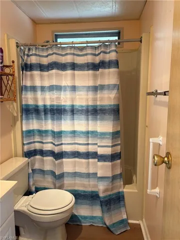 Full bath featuring vanity and toilet
