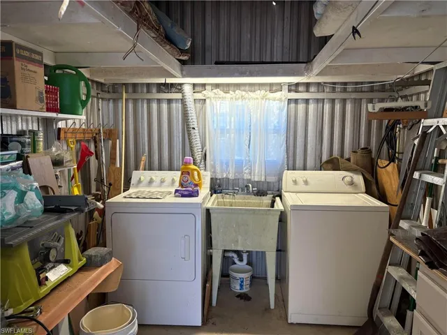 Laundry area featuring independent washer and dryer and laundry area