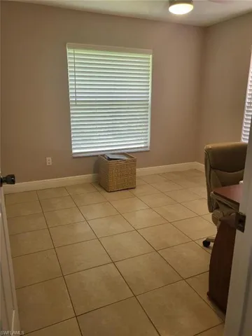 Unfurnished office with light tile patterned floors
