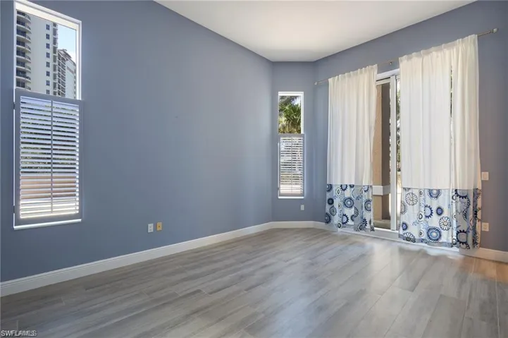 Unfurnished room with hardwood / wood-style floors