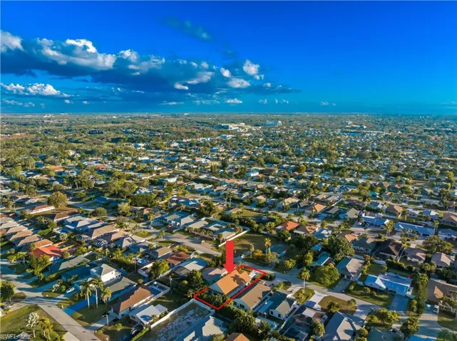 Aerial overview of property's location with nearby suburban area and property boundaries highlighted
