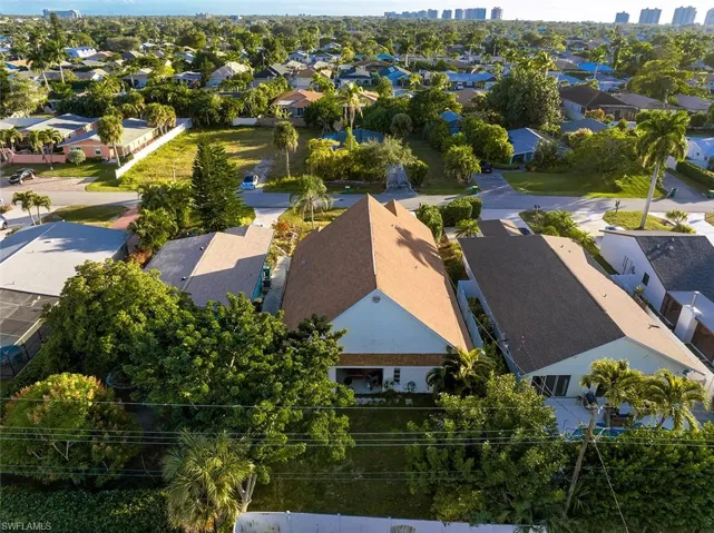 Aerial view of residential area with city skyline