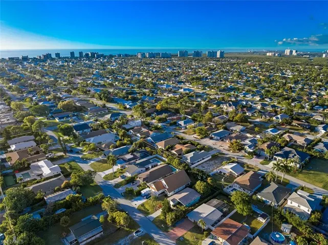 Aerial view of property's location featuring nearby suburban area