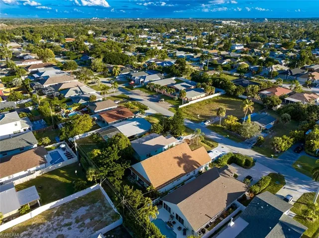 Aerial view of property's location featuring nearby suburban area