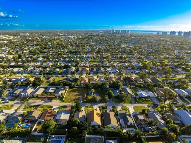 View of property location with nearby suburban area and a large body of water