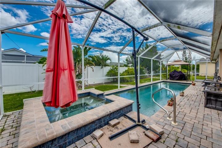 Pool and spa with screen enclosure