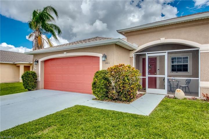 Left unit with screened front porch and keypad entry.