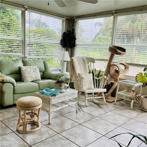 Sunroom featuring tile patterned flooring