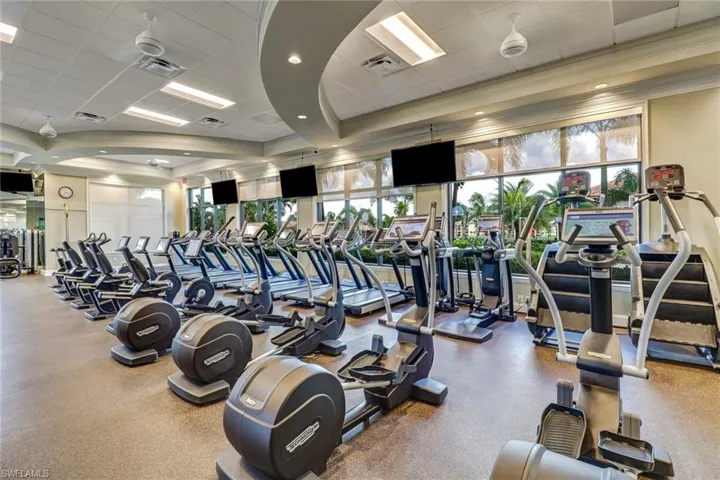 Exercise room featuring a paneled ceiling and crown molding
