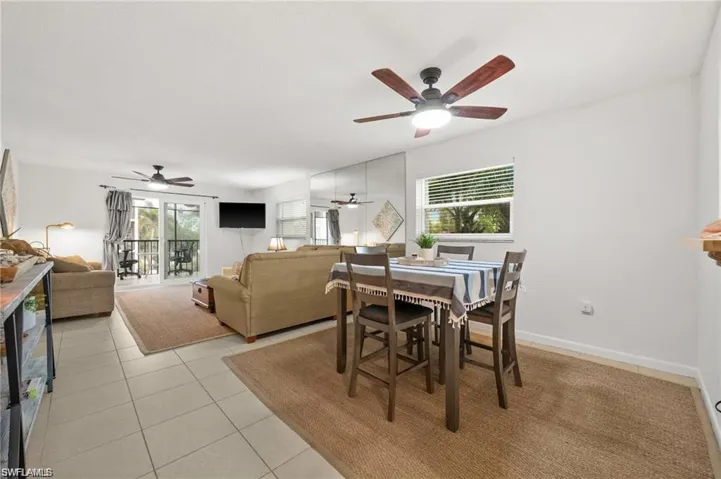 Dining area with healthy amount of natural light and light tile patterned floors