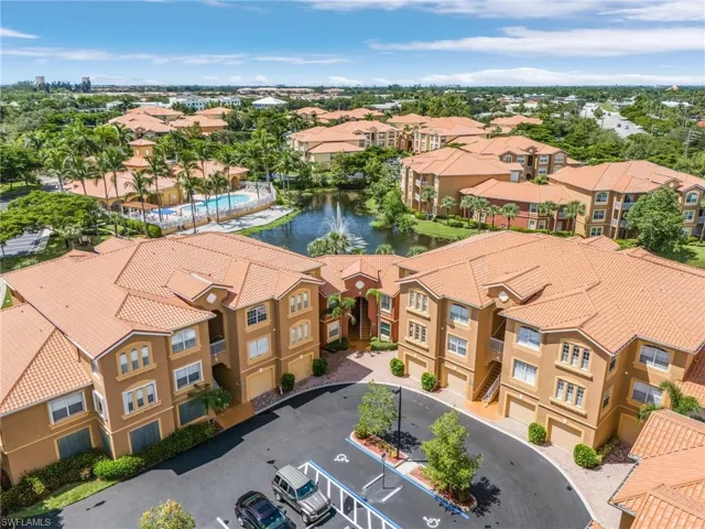 Aerial perspective of suburban area with a large body of water