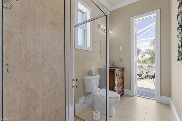 Pool deck access to this HUGE shower bathroom.