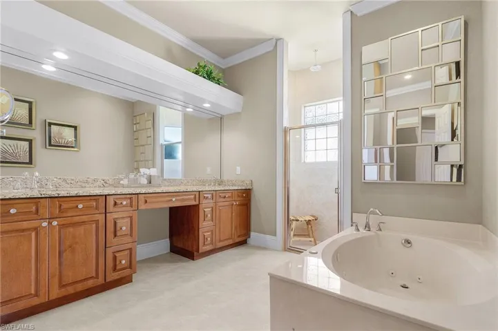 Master bathroom has a separate HUGE jetted tub, extremely large shower stall, double vanities, granite countertop, separate water closet, and tile floors.