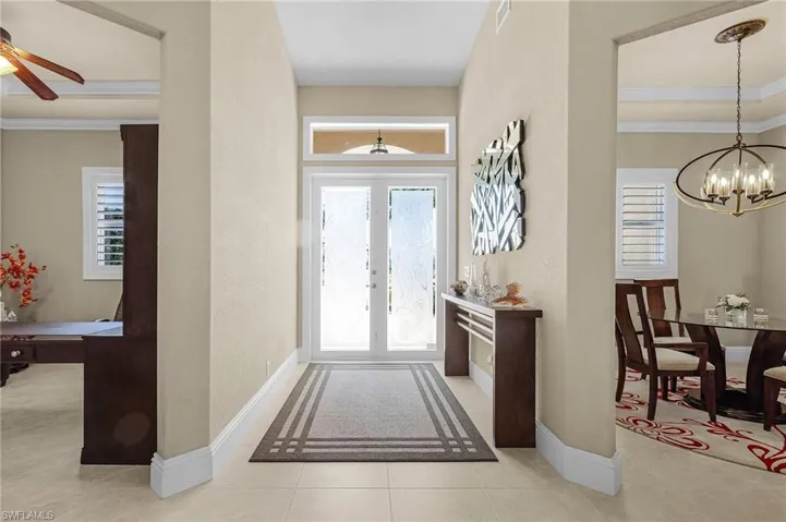 The Den and Formal Living and Dining flank the entryway