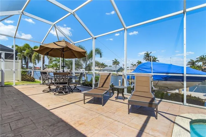 A Sun Deck w/umbrella table and lounge chairs.BOAT NOT INCLUDED