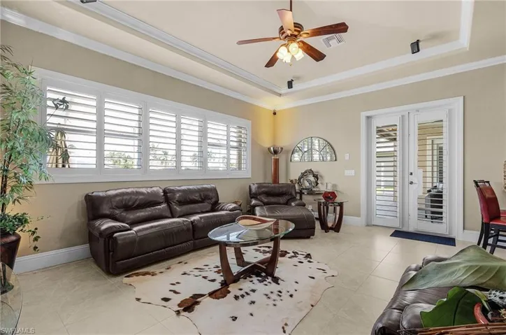 Natural light abounds in the casual family area and it allows access to pool deck