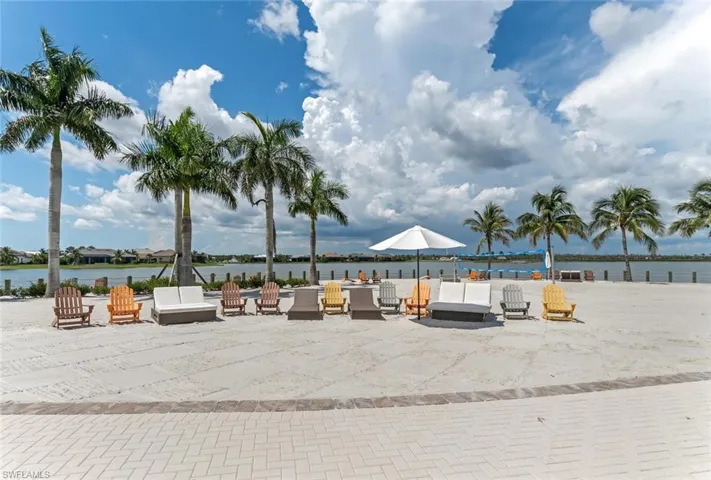 View of property's community featuring a water view and a patio