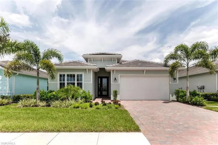 View of front of property with a garage