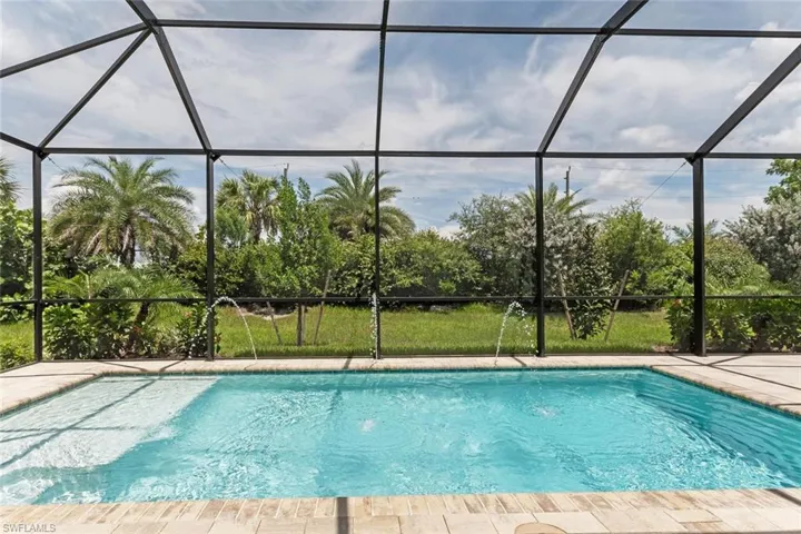 View of pool with a lanai