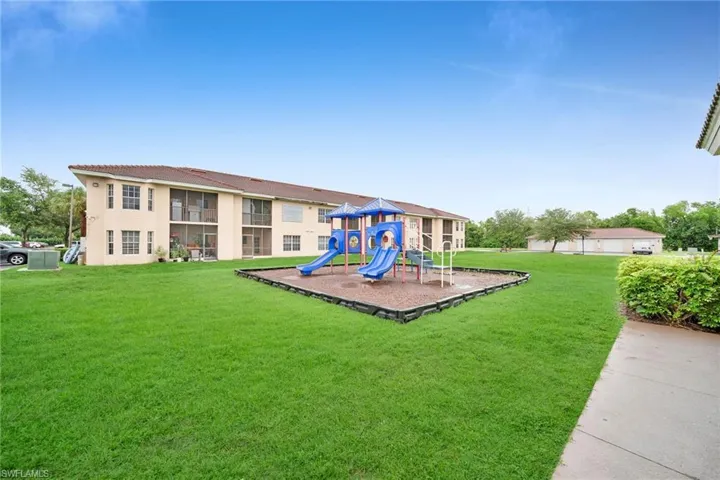 View of play area featuring a yard