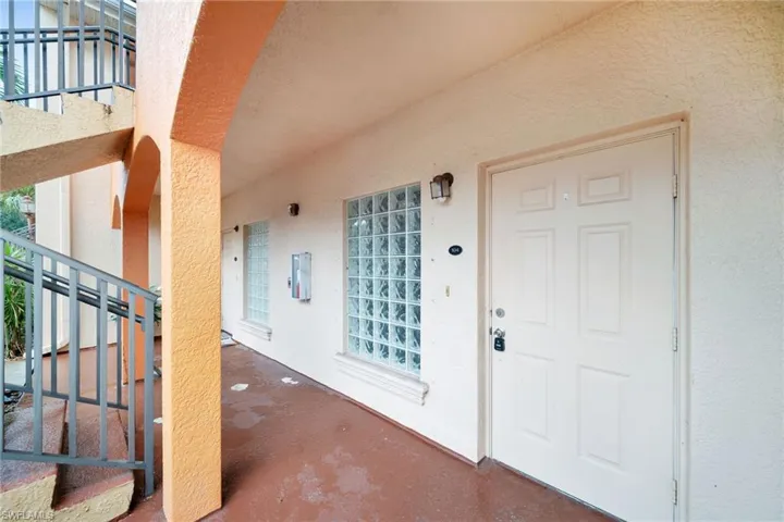 Property entrance with a balcony