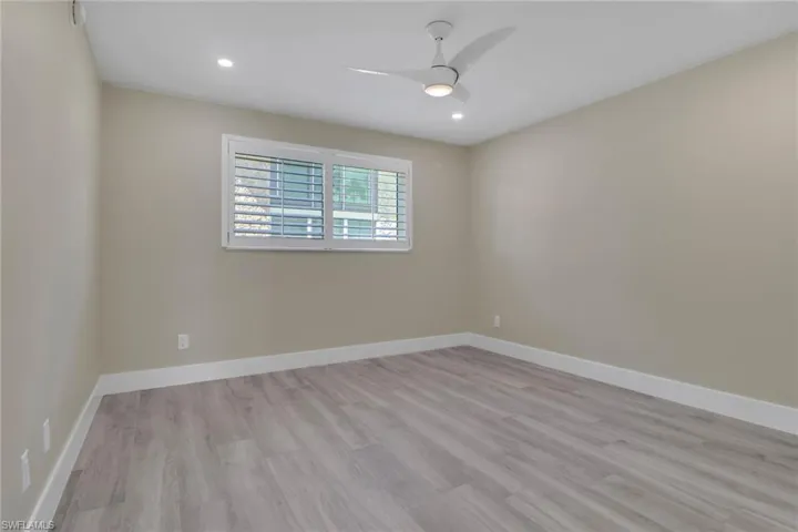 Spare room with light wood-style floors, recessed lighting, and ceiling fan