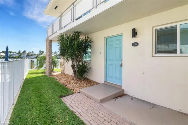 Property entrance with stucco siding