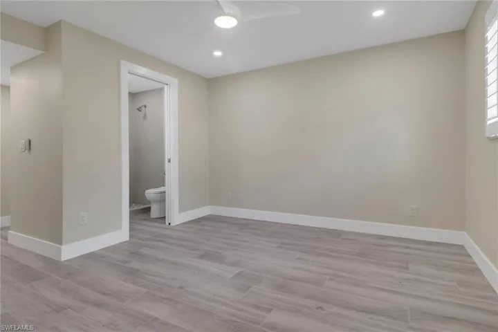 Unfurnished room featuring a ceiling fan, light wood-style floors, and recessed lighting