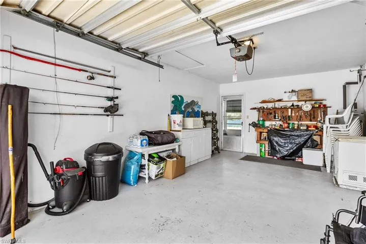 Garage featuring a garage door opener