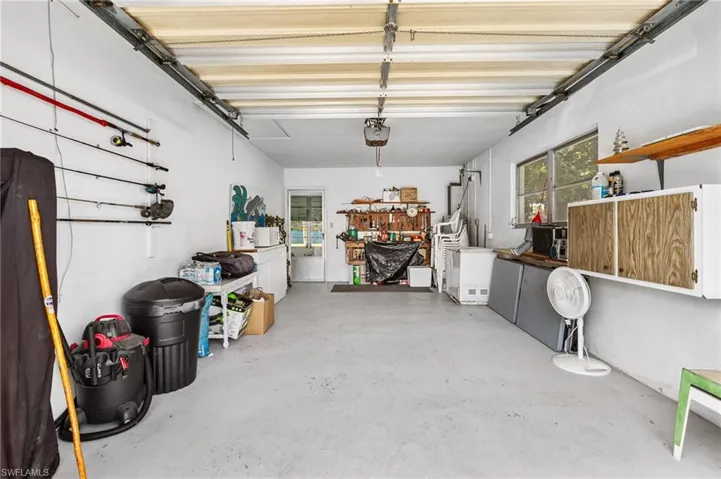 Garage featuring a garage door opener