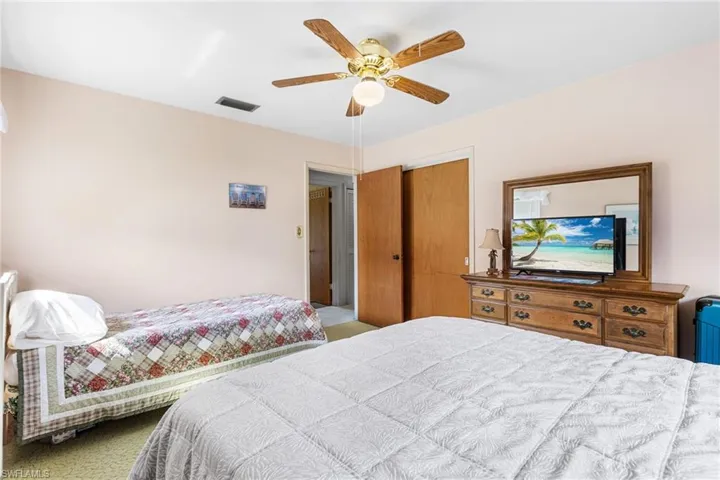 Bedroom featuring a closet and ceiling fan