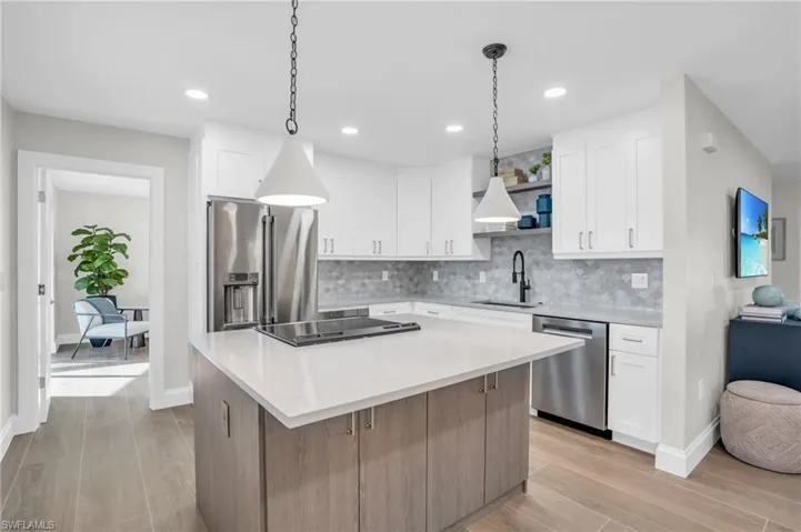 Wow! It feels like a model home with all the latest in kitchens.  Large Island for hanging out and the latest upgrades in appliances and cabinetry