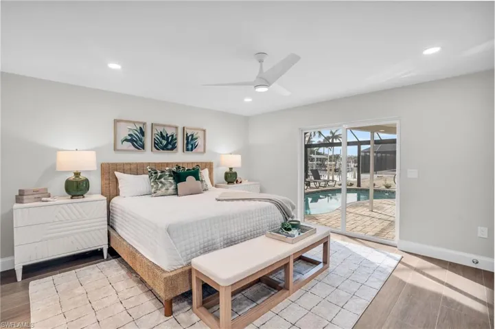 Guest Suite feels like a Primary Bedroom as well.  Sliders out to the pool/lanai with so much natural light