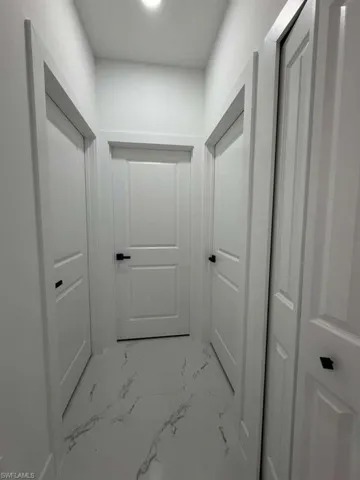 Corridor with marble finish flooring