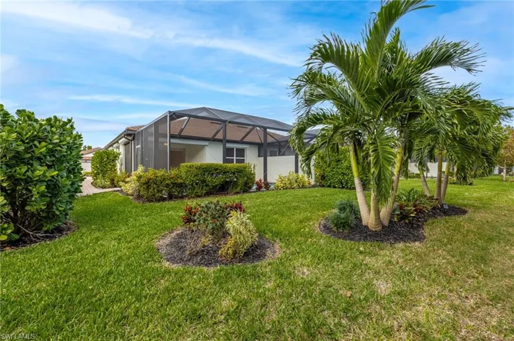 View of yard featuring glass enclosure