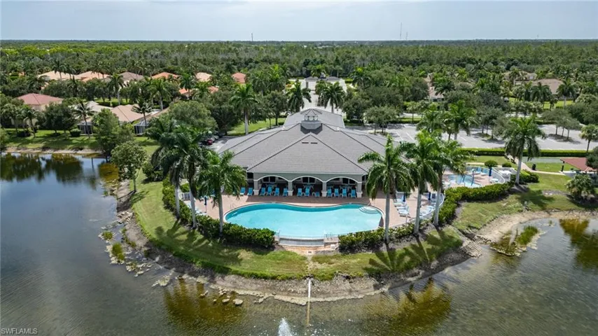 Central community building featuring a swimming pool and expansive deck