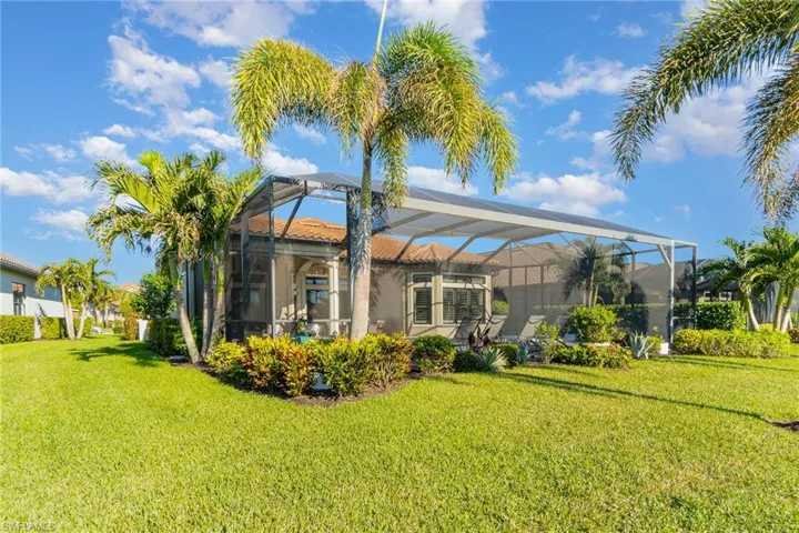 View of yard with a lanai