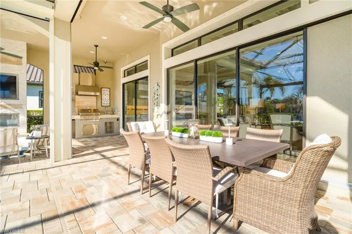 View of patio / terrace featuring ceiling fan, exterior kitchen, and grilling area