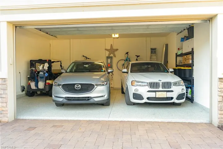 Garage with electric panel and a garage door opener