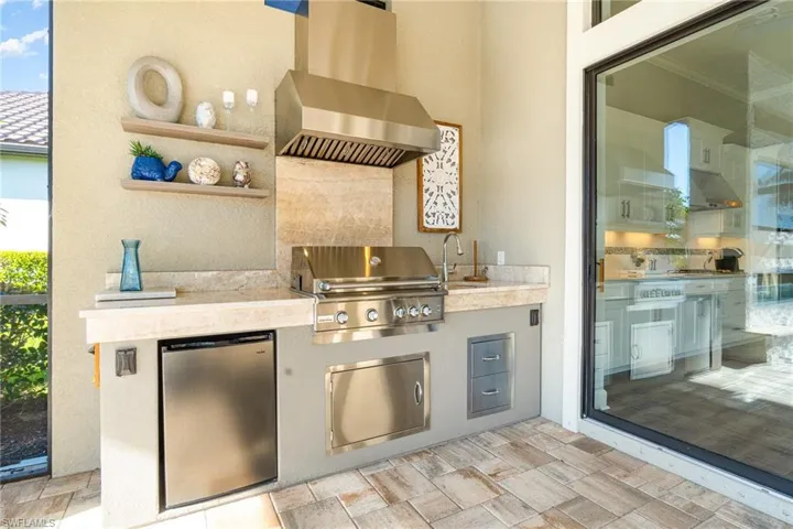 View of patio / terrace with area for grilling and sink